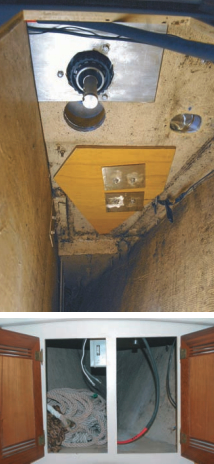 The windlass drive shaft (without the motor installed) protrudes through the stainless-steel backing plate. The chain drop hole is in the center. The previous hawser hole is the oval hole at the right. Notice the reinforcement plate for the windlass.