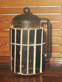 No scrap went to waste. Even the French press received an insulation treatment. The scored and wrapped cylinder demonstrates how to fit a curved shape using Celotex.
