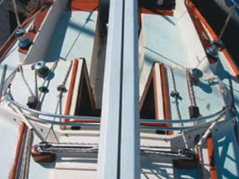 The mid-boom traveler on the cabintop, above, was one of the reasons Geoff Cooke bought his 1975 Tartan 30. What the previous owner (who made the conversion from end-boom to mid-boom sheeting) didn’t realize was that a stronger boom should have been installed at the same time. Considering the increased loads it took and the weakening caused by the additional holes drilled in it, the original boom held up remarkably well for many years until one day a mild jibe finished it off.