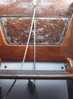 Companionway door slats must be physically attached to the boat to prevent them from being washed overboard.