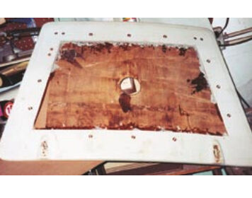 The job begins with a router cut, above, to allow for the removal of the top fiberglass layer. Next, the fiberglass skin is peeled back and the wet core is removed, at center, ready for a replacement layer of Masonite. While curing, the repair is clamped through the center hole, bottom.