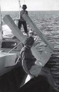 Ian and his wife, Alicia, fold an early prototype. Alicia paid the bills while Ian developed his ama folding system and early boats.