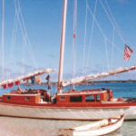 Teresa, Reuel’s cold-molded wood Exuma 44 cat schooner beached in the Bahamas. Note the stainless-steel-pipe stern davits for Gandy Dancer.