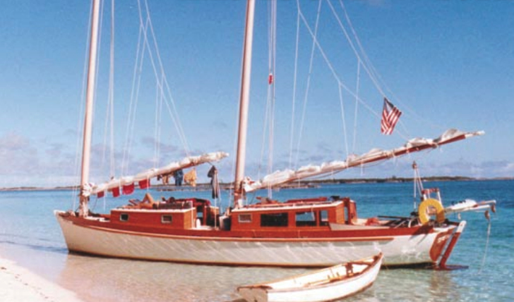 Teresa, Reuel’s cold-molded wood Exuma 44 cat schooner beached in the Bahamas. Note the stainless-steel-pipe stern davits for Gandy Dancer.