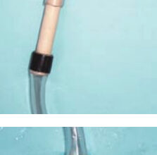 The cardboard tubes inside the hose clamps, shown at top, must remain in place until the hose clamp is used. The original test setup, middle, and the salvaged test with a stainless-steel clamp, above. This test also failed.
