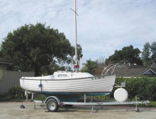 The Montgomery 17, a fiberglass boat with molded-in lapstrake detail, is a member of the successful family of trailerable cruising boats. Endelig, home port Santa Barbara, California, is ready to roll, at left.