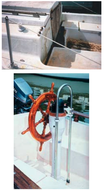 Like the remainder of the interior and exterior of the project boat, the cockpit, above, was a mess. At left, the new cockpit gleamed once the cleaning and painting were finished and the new wheel was installed. Although they also painted the interior, the hull, and the bottom, the most difficult painting job, Richard says, was the deck, since some areas of the cockpit were difficult to reach and nonskid is tricky. Painting the hull was the most rewarding of the painting projects.