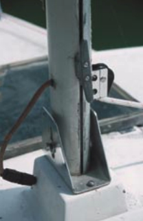 The deck-stepped mast is supported by a wooden compression post belowdecks.