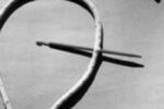 Step 1. Measure five or six fid lengths from the end of the line. Either tie a knot or carefully put a fid through the cover and core. Holding the knot or fid, smooth the cover from the knot to the end.