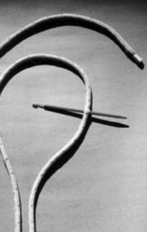 Step 1. Measure five or six fid lengths from the end of the line. Either tie a knot or carefully put a fid through the cover and core. Holding the knot or fid, smooth the cover from the knot to the end.