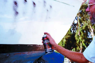 Misting the paint with contrasting lacquer aids in seeing where you have sanded.