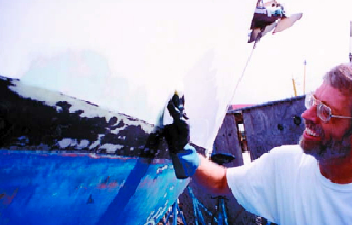 Solvent wiping in a downward sweep. The hull was wiped completely prior to sanding.