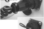 The closed cockpit receptacle by AMP, at right, and the receptacle in use. Advantages over the lowly cigarette lighter receptacle? At the top of the list are a twist-lock connection, so there are no surprises when unplugging, and a weather-resistant cap.
