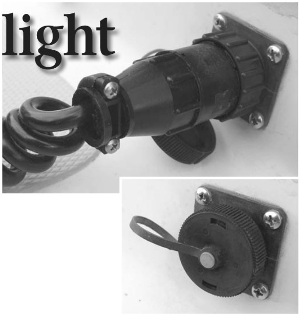 The closed cockpit receptacle by AMP, at right, and the receptacle in use. Advantages over the lowly cigarette lighter receptacle? At the top of the list are a twist-lock connection, so there are no surprises when unplugging, and a weather-resistant cap.