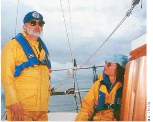 man and woman on a sailboat