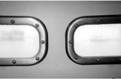 John Karklins’ finished portlights above. He recommends against using polycarbonate. It gets cloudy, as the illustration shows. The teak spacer he added to compensate for the additional thickness of his “armor-plated windows” shows around the edges of the frame.