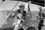 Cathy McIntire and her husband, Ken, who is shown with an additional crewmember, see cruising as a calculated risk. Their goal is to tip the odds in their favor.