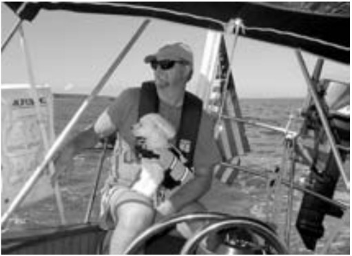 Cathy McIntire and her husband, Ken, who is shown with an additional crewmember, see cruising as a calculated risk. Their goal is to tip the odds in their favor.