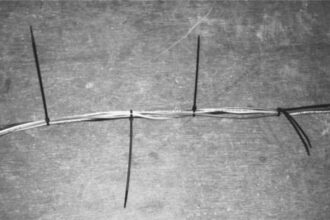 Cable ties to the rescue: when the wires inside Gregg’s mast kept him up at night, he was determined to fix the problem by preventing them from dangling loosely.