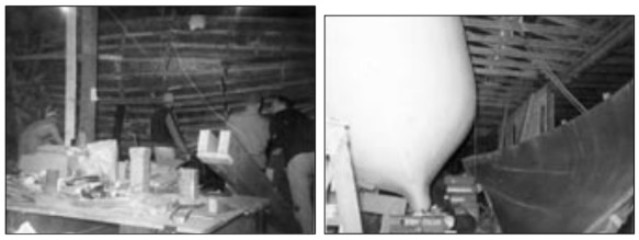 Wade Cornwell, Henry Morton, and Jarvis Gould prepare to remove the two-piece mold from the first Chinook, at left. Second half off, at right.