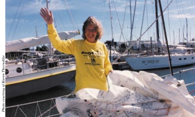 Karen prepares for departure in Mar del Plata, Argentina. An autographed sail is shown in foreground.