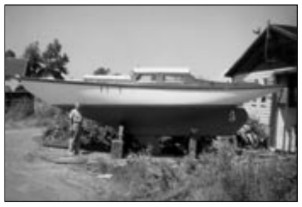 June 1958, Chinook No. 6, Falcon, the first boat produced for sale, sits in the yard at Yacht Constructors, ready for customer Donald Laird (pictured).