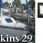 Frank Fitzhenry’s license plate, above, depicts the signal flags “S” and “H,” for Safety Harbor, Florida, the town where he keeps his boat. His Watkins 29 sloop, at left, is one of the few sailboats registered as a U.S. Coast Guard Auxiliary patrol boat. He uses it to teach his boating safety students about aids to navigation, knotwork, and such.