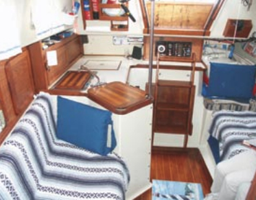 Better Days has a standard interior layout with the galley at the base of the companionway and settee/bunks in the main cabin.