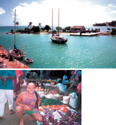 The Way is tied to a sunken barge in the lagoon of Fanning Island, Kiribati, at right. Below, Zoltan shops for eggplant in the Suva market in Fiji.