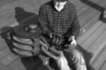 Who’s this gnome? We don’t mean to frighten you, but look what happened to Don Launer before he learned to give his wooden blocks regular maintenance. Actually, he says the large one, which weighs more than 90 pounds, was used to hoist cargo aboard a World War II Liberty Ship.