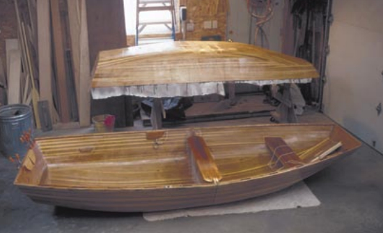 The two dinghies, at right. The larger 11- foot version, in front, is back in the shop for repair and modification. The 9-footer has removable center and rear thwarts that can be stored in a bag under the bow thwart. Another bag holds the come-apart oars. The bow section of the 9-footer with the seats and oars in it weighs 42 pounds. It weighs 29 pounds without them. The stern section weighs 31 pounds.
