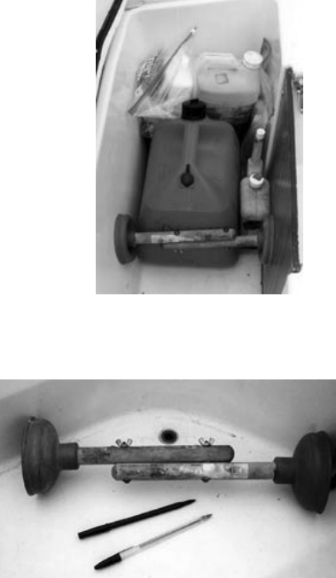 Everything in its place and a place for everything (all having at least two uses, of course). Plungers clear the cockpit drains and keep the fuel tank and gear where they belong.