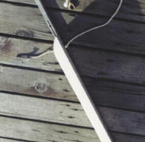 Fool a short dinghy into acting like a bigger boat by adding an extension to the aft end of the keel. The removable extension Paul developed attaches by inserting the tube at the top of this photo into a fixture he added to the keel of his Boatex dinghy. The line keeps the extension from being lost and sinking during the critical seconds it takes to attach it to the dinghy.