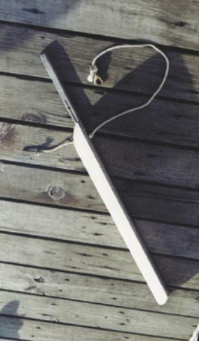 Fool a short dinghy into acting like a bigger boat by adding an extension to the aft end of the keel. The removable extension Paul developed attaches by inserting the tube at the top of this photo into a fixture he added to the keel of his Boatex dinghy. The line keeps the extension from being lost and sinking during the critical seconds it takes to attach it to the dinghy.