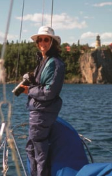 Picture of someone with a camera on a boat