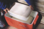Rubbermaid to the rescue with refillable, refreezable, reusable block ice. And once you own the plastic tubs, the price of ice is nice.