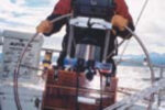 Picture of someone steering a boat
