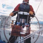Picture of someone steering a boat