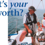 Picture of two people wearing life jacks on a boat