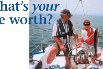 Picture of two people wearing life jacks on a boat