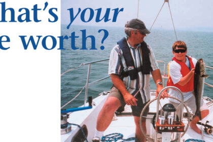 Picture of two people wearing life jacks on a boat