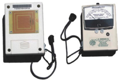The front of the J. R. Overseas moisture meter, above, shows the moisture scale, while the back side, at left, shows the sensitive sensors.