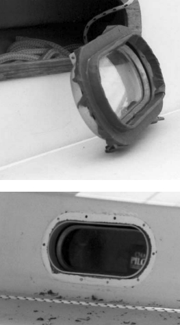 Mask the clean portlight spigot with three layers of tape on the outside and one layer of tape on the inside, above. Ready for re-installation, at right. Notice the dark areas where the gaps were. These are now filled with body filler. The surfaces are flush on both sides.