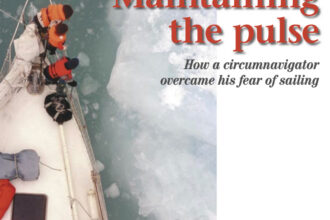Driver in the Spitsbergen ice with the kids on the bow in 2000.