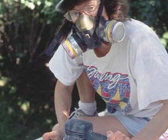 Picture of someone sanding a boat deck