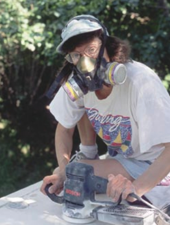 Picture of someone sanding a boat deck