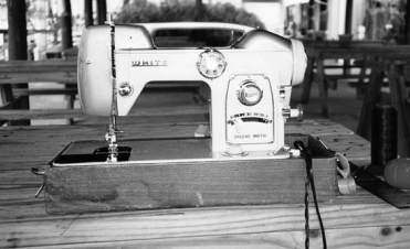 Home sewing machine doing duty outdoors.
