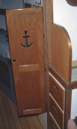 The original locker door in Ken’s Seabreeze was built of teak, but the new bookcase side he added later was made of stained red oak. He notes that the color difference — unlike on the cabin sole — is hardly discernible between the two finished pieces.