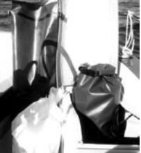 Tough vinyl-coated nylon dry bags used by kayakers hold accumulated trash until a dumpster can be found.