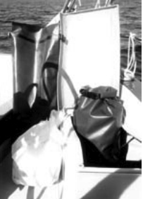 Tough vinyl-coated nylon dry bags used by kayakers hold accumulated trash until a dumpster can be found.